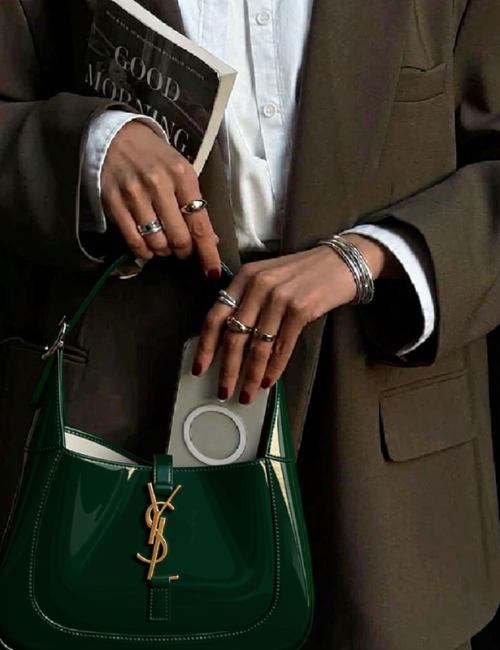 hands pulling phone out of a handbag