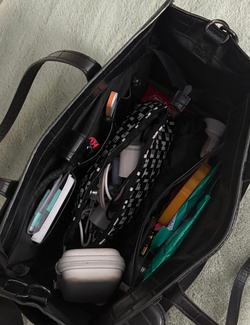 handbag with all kinds of things inside to look overflowing